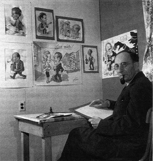 Max at his desk where he created cartoons for the weekly edition of the camp newspaper