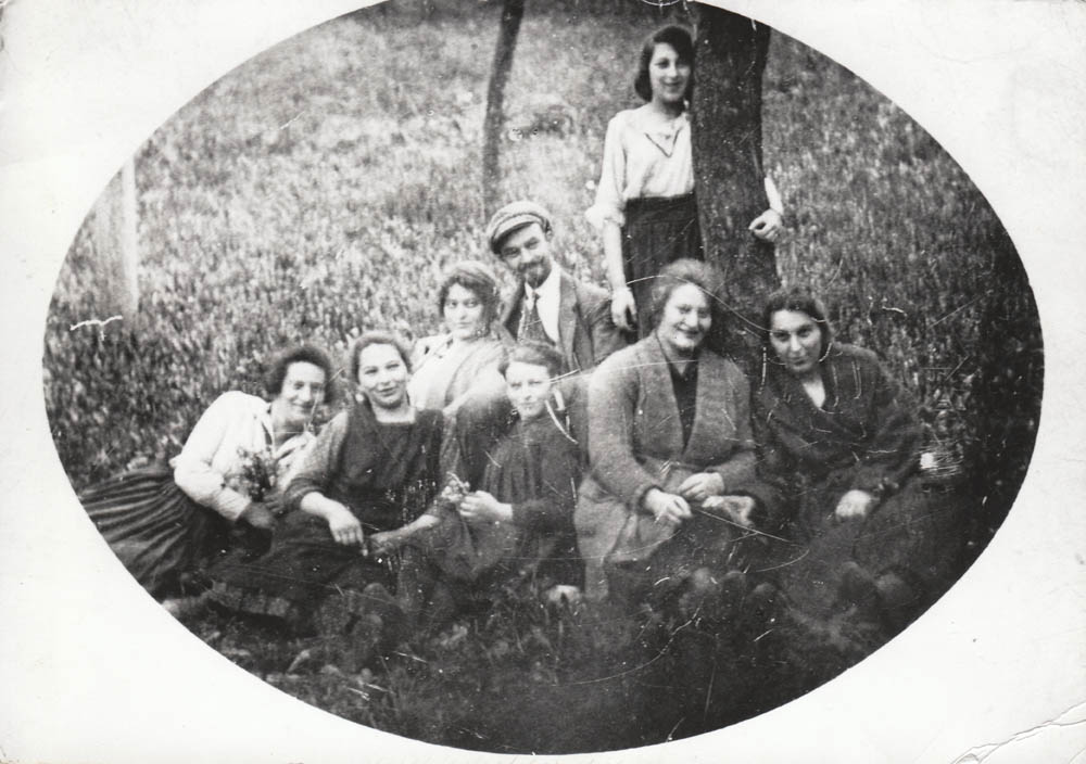 The Schotten daughters in happier times. Right to left (front): A cousin, Johanna/Chana/Janka, Sophie, Esther, Irma, (Back row): Malvine and Menachem Lipschutz (her husband); At the tree - a cousin's daughter